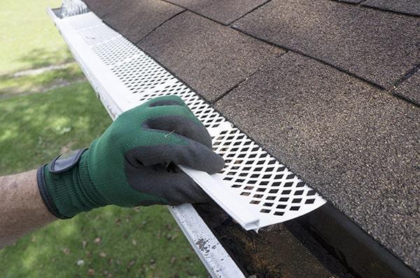 gutter guards are designed to cover the gutter and allow water to flow through while keeping leaves and debris out